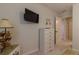 Neutral bedroom with TV and 5-drawer dresser at 15691 Sw 11Th Court Rd, Ocala, FL 34473