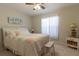 Bright bedroom featuring a ceiling fan and a window with coverings at 15691 Sw 11Th Court Rd, Ocala, FL 34473