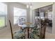 Cozy breakfast nook with a glass table, decorative chairs, and lots of natural light at 15691 Sw 11Th Court Rd, Ocala, FL 34473