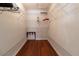 Walk-in closet featuring built-in wire shelving and laminate wood flooring at 15691 Sw 11Th Court Rd, Ocala, FL 34473