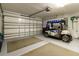 Spacious garage with golf cart, and ample room for storage at 15691 Sw 11Th Court Rd, Ocala, FL 34473