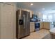 Updated kitchen featuring stainless steel refrigerator, microwave, and ample cabinet space at 15691 Sw 11Th Court Rd, Ocala, FL 34473