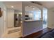 Modern kitchen with stainless steel appliances and white cabinetry open to the dining area at 15691 Sw 11Th Court Rd, Ocala, FL 34473