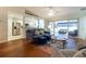 Bright, open living space with hardwood floors, leading to the kitchen and screened porch at 15691 Sw 11Th Court Rd, Ocala, FL 34473