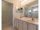 Elegant main bathroom with double sinks, a large mirror, and ample counter space at 15691 Sw 11Th Court Rd, Ocala, FL 34473