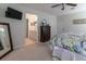 Relaxing main bedroom with neutral colors, a dresser, and a view into the bathroom at 15691 Sw 11Th Court Rd, Ocala, FL 34473
