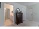 Main bedroom with a dresser, ensuite bathroom, and neutral colors, creating a serene retreat at 15691 Sw 11Th Court Rd, Ocala, FL 34473