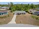 Aerial view of house with a well-manicured front yard and neutral colored exterior at 17147 Sw 42Nd Ct, Ocala, FL 34473