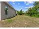 Side view of the backyard of this home shows the outdoor space and landscaping at 17147 Sw 42Nd Ct, Ocala, FL 34473