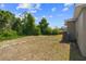 Backyard with a patch of green grass offers space for outdoor activities and relaxation at 17147 Sw 42Nd Ct, Ocala, FL 34473