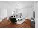 Bright living area with wood floors, modern furniture, and neutral décor for a comfortable atmosphere at 17147 Sw 42Nd Ct, Ocala, FL 34473