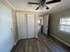 Bedroom featuring a closet, wood floors, and natural light at 21135 Sw Honeysuckle St, Dunnellon, FL 34431