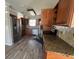 Spacious kitchen featuring stainless steel appliances, wood cabinets, and stone countertops at 21135 Sw Honeysuckle St, Dunnellon, FL 34431