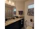 Bathroom featuring a dark wood vanity, granite countertop and shower with curtain at 3154 Merrit Ln, The Villages, FL 32163