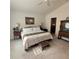 The primary bedroom features an ensuite bathroom and neutral decor at 3154 Merrit Ln, The Villages, FL 32163