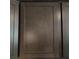 Close-up showcasing the elegant design and rich wood grain of kitchen cabinets at 3154 Merrit Ln, The Villages, FL 32163