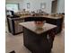 Well-equipped kitchen showcasing granite countertops and an efficient layout at 3154 Merrit Ln, The Villages, FL 32163