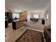 Open floor plan featuring kitchen with breakfast bar overlooking living and dining areas at 3154 Merrit Ln, The Villages, FL 32163