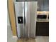 Modern kitchen featuring a stainless steel, side-by-side refrigerator with a water and ice dispenser at 3154 Merrit Ln, The Villages, FL 32163