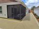 Enclosed screened porch showcasing an entertainment area and a lovely patio at 3154 Merrit Ln, The Villages, FL 32163