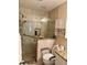 Modern bathroom featuring a glass-enclosed shower with tile walls and a granite countertop at 4145 Se 3Rd St, Ocala, FL 34471