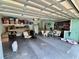 A spacious garage with plenty of room for storage, featuring open shelving and a bright interior at 4145 Se 3Rd St, Ocala, FL 34471