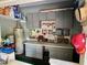 Well-organized garage space with built-in cabinets, a workbench, and plenty of storage for tools and equipment at 4145 Se 3Rd St, Ocala, FL 34471