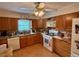 Traditional kitchen with wood cabinetry, stainless steel appliances, and laminate countertops at 4145 Se 3Rd St, Ocala, FL 34471