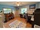 Spacious office with hardwood floors, two windows and a ceiling fan at 4145 Se 3Rd St, Ocala, FL 34471