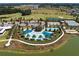 Overhead view of a resort-style pool and tennis courts in the community at 4379 Nw 56Th Ct, Ocala, FL 34482