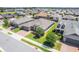 An aerial view shows a lovely single-Gathering home with a paver driveway in a neighborhood full of well-maintained homes at 4379 Nw 56Th Ct, Ocala, FL 34482