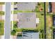 Aerial view of a well maintained backyard featuring a paver patio and lush lawn at 4379 Nw 56Th Ct, Ocala, FL 34482