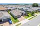 An aerial view shows a lovely single-Gathering home with a paver driveway in a neighborhood full of well-maintained homes at 4379 Nw 56Th Ct, Ocala, FL 34482