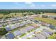 Areal view of a new construction community featuring homes with landscaping near green spaces and wooded areas at 4379 Nw 56Th Ct, Ocala, FL 34482