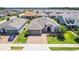Aerial view of a lovely single-Gathering home with a paver driveway in a neighborhood full of well-maintained homes at 4379 Nw 56Th Ct, Ocala, FL 34482
