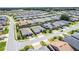 Birds eye view of a residential neighborhood featuring well-maintained homes, manicured lawns and wide paved streets on a sunny day at 4379 Nw 56Th Ct, Ocala, FL 34482