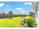 Lush backyard with well-kept lawn, landscape beds, and modern fence, offering a private outdoor sanctuary at 4379 Nw 56Th Ct, Ocala, FL 34482