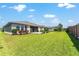 Expansive backyard features a well-maintained lawn and patio, providing a private outdoor retreat at 4379 Nw 56Th Ct, Ocala, FL 34482