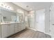 Elegant bathroom with double vanity, stylish tile floors, and a glass-enclosed shower with white tiles at 4379 Nw 56Th Ct, Ocala, FL 34482