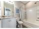 Bathroom featuring tub with shower, modern vanity, and a neutral color palette at 4379 Nw 56Th Ct, Ocala, FL 34482