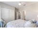 Bedroom with closet and ensuite bathroom showcasing great room flow and storage at 4379 Nw 56Th Ct, Ocala, FL 34482