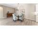 Dining area with a glass table, decorative chairs, and stylish decor at 4379 Nw 56Th Ct, Ocala, FL 34482