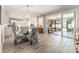 Open dining and kitchen area, with a glass-top table and view to the screen patio at 4379 Nw 56Th Ct, Ocala, FL 34482