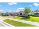 Charming single-story home boasts a three-car garage, arched entryway, and manicured lawn at 4379 Nw 56Th Ct, Ocala, FL 34482