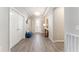Stylish foyer featuring tile flooring, decorative lighting, and a blue bench seat at 4379 Nw 56Th Ct, Ocala, FL 34482