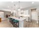 Spacious kitchen with large island, pendant lighting, and stainless steel appliances at 4379 Nw 56Th Ct, Ocala, FL 34482