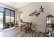 Lanai dining area with wall art, providing serene ambiance with an outdoor view at 4379 Nw 56Th Ct, Ocala, FL 34482