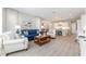 Bright, open living area featuring modern tile floors and comfortable seating with seamless flow to the kitchen at 4379 Nw 56Th Ct, Ocala, FL 34482
