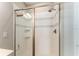 Close-up of a stylish tiled shower with glass door and modern fixtures and a white tile pattern at 4379 Nw 56Th Ct, Ocala, FL 34482
