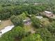 Aerial view of the home surrounded by lush trees and landscaping at 4430 Se 47Th Pl, Ocala, FL 34480